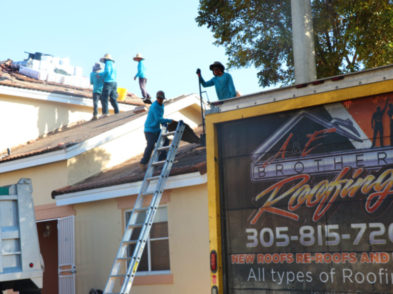 roofing workers removing old roof in miami near sweetwater