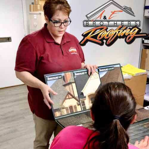 roofing customer picking out tiles from catalog