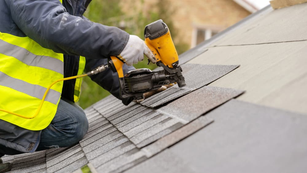 Roofer Installing Asphalt Shingles