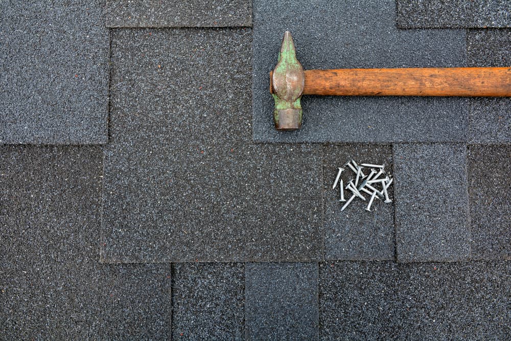 Hammer and Nails on Shingle Roof
