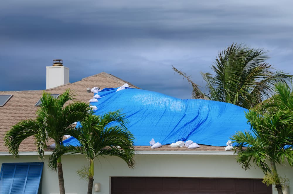 Blue Tarp over a house roof